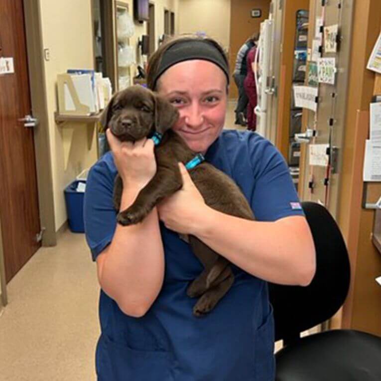 good hope animal hospital team member holding a dog